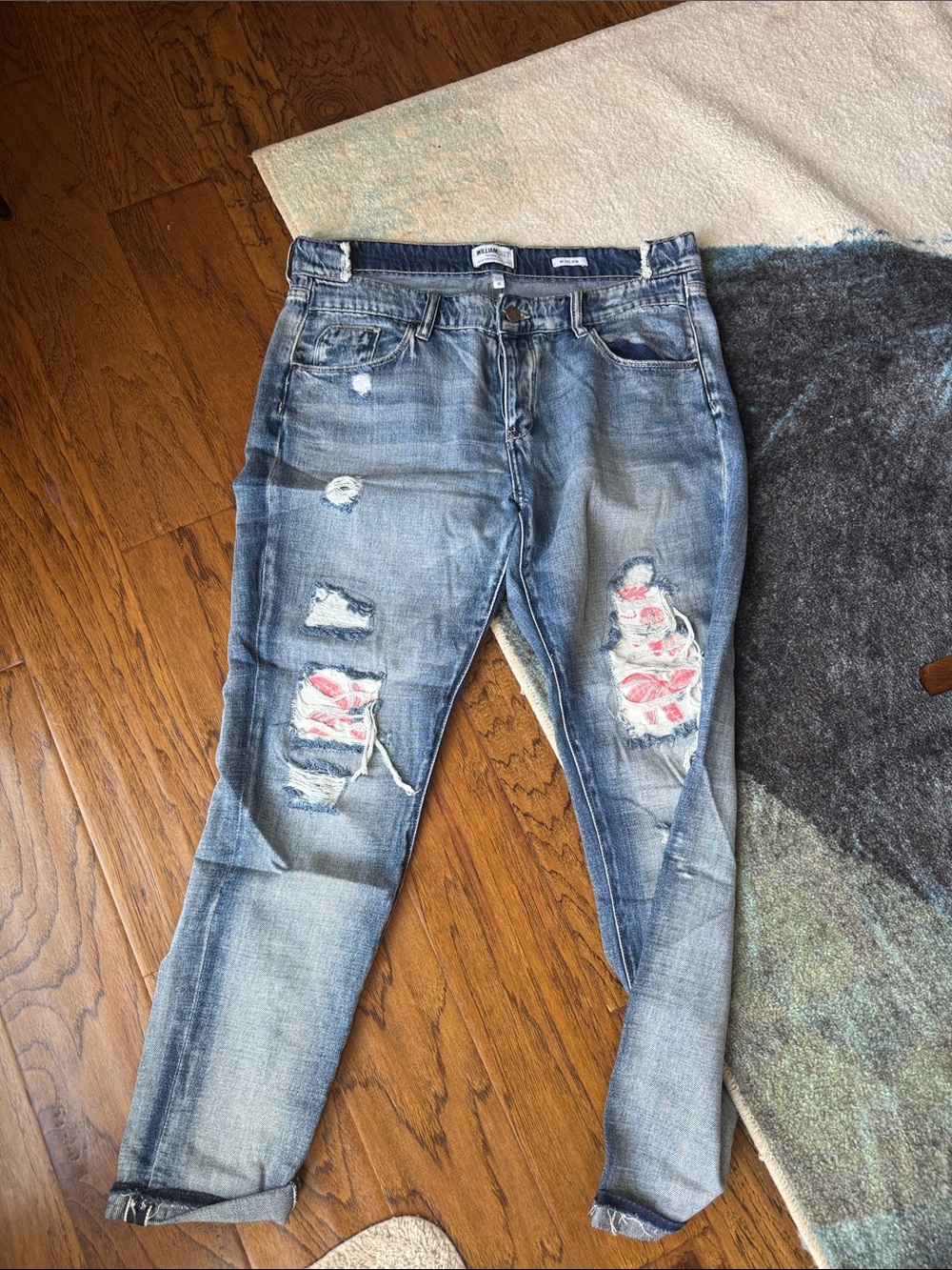 William Rast Women's Light Blue Distressed Boyfriend Jeans with Floral Pattern.